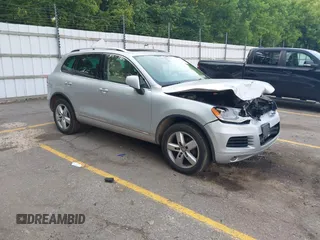 2011 Volkswagen Touareg Lux with VIN WVGFK9BP5BD003521, listed as a IAAI auction lot 42458276 with 221,650 mi miles and . Bid and sale history available at DreamBid. Image 1.