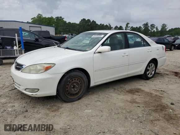 2004 Toyota Camry LE z VIN JTDBE32K440281087, wystawiony jako Copart lot #60486995 z przebiegiem 229 856 mil mil oraz Czysty tytuł • Clean title. Historia ofert i sprzedaży dostępna na DreamBid. Obrazek 1.