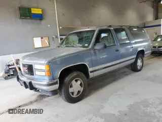 1994 GMC Suburban z VIN 1GKFK16K3RJ725171, wystawiony jako Copart lot #57914635 z przebiegiem 226 183 mil mil oraz Tytuł czysty. Historia ofert i sprzedaży dostępna na DreamBid. Obrazek 1.
