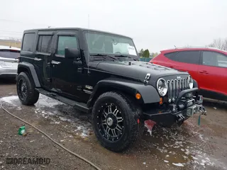 2011 Jeep Wrangler Unlimited Sahara with VIN 1J4BA5H12BL548870, listed as a IAAI auction lot 42010303 with 139,693 mi miles. Bid and sale history available at carsss.com. Image 1.