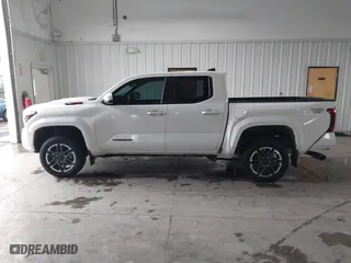 2024 Toyota Tacoma 4WD SR5 with VIN 3TMLB5JN8RM035278, listed as a IAAI auction lot 41789088 with 10,695 mi miles. Bid and sale history available at carsss.com. Image 14.