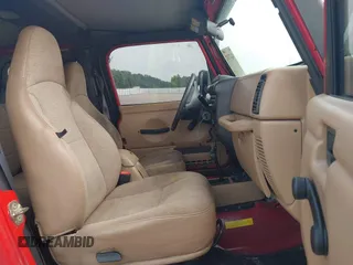 2001 Jeep Wrangler Sport z VIN 1J4FA49S31P335680, wystawiony jako IAAI lot #42471312 z przebiegiem 212 927 mil mil oraz . Historia ofert i sprzedaży dostępna na DreamBid. Obrazek 5.