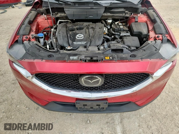2018 Mazda CX-5 Grand Touring with VIN JM3KFADM8J0451535, listed as a Copart auction lot 59990435 with 77,163 mi miles and Salvage title. Bid and sale history available at DreamBid. Image 12.