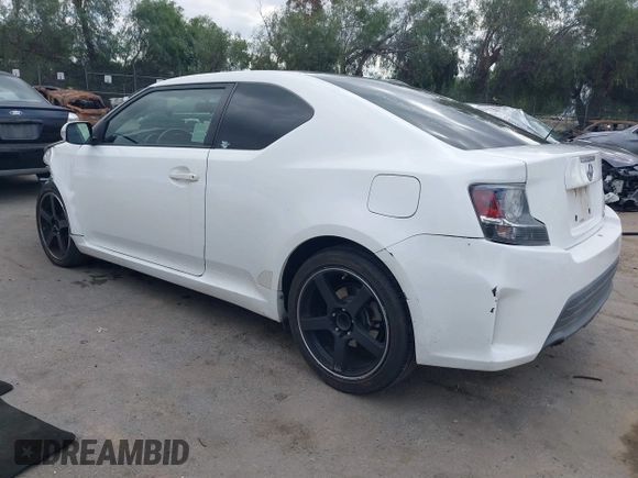 2014 Scion tC with VIN JTKJF5C79E3075707, listed as a IAAI auction lot 41557310 with 132,468 mi miles. Bid and sale history available at carsss.com. Image 3.