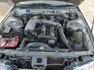 1992 Nissan Skyline z VIN HNR32035831, wystawiony jako Copart lot #74228974 z przebiegiem 49 082 mil mil oraz Szkoda całkowita • Salvage title. Historia ofert i sprzedaży dostępna na DreamBid. Obrazek 11.