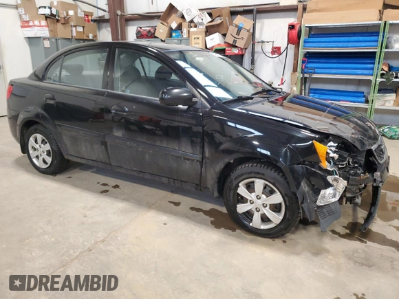 2010 Kia Rio with VIN KNADH4B37A6641845, listed as a Copart auction lot 51861215 with 163,894 mi miles and Salvage Title. Bid and sale history available at DreamBid. Image 4.