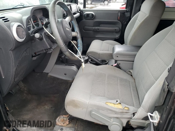 2009 Jeep Wrangler Sahara with VIN 1J4FA54109L702963, listed as a Copart auction lot 89211555 with 125,138 mi miles and Clean title. Bid and sale history available at DreamBid. Image 7.