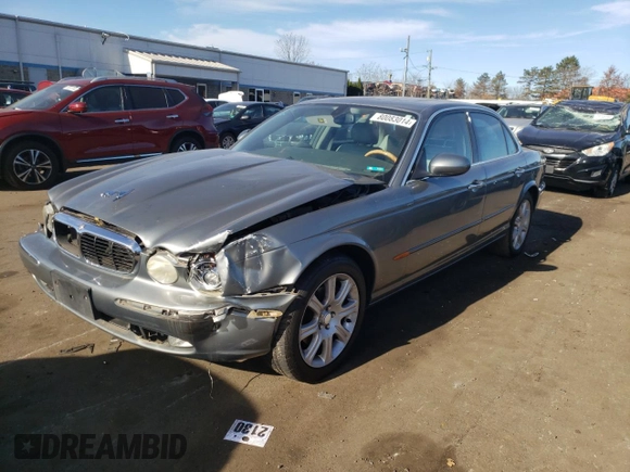 2004 Jaguar XJ with VIN SAJWA71C74SG34056, listed as a Copart auction lot 80083014 with 0 mi miles and Salvage Title. Bid and sale history available at carsss.com. Image 1.