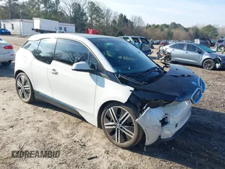2014 BMW i3 z VIN WBY1Z2C51EV285264, wystawiony jako IAAI lot #41514729 z przebiegiem 99 442 mil mil oraz . Historia ofert i sprzedaży dostępna na DreamBid. Obrazek 1.