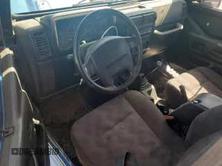 2003 Jeep Wrangler Sport z VIN 1J4FA49S53P350281, wystawiony jako Copart lot #56634005 z przebiegiem 158 974 mil mil oraz Szkoda całkowita • Salvage title. Historia ofert i sprzedaży dostępna na DreamBid. Obrazek 8.
