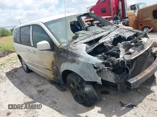 2013 Dodge Grand Caravan SXT with VIN 2C4RDGCG5DR524074, listed as a IAAI auction lot 37312051 with Not Provided miles and . Bid and sale history available at DreamBid. Image 1.