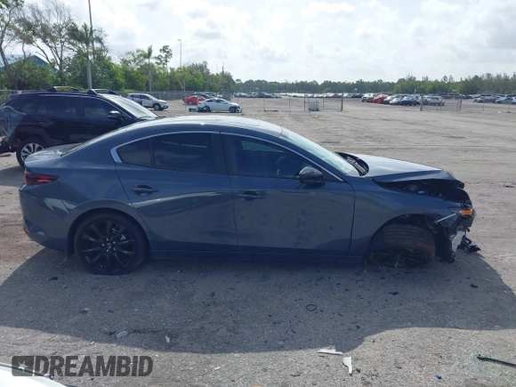 2024 Mazda 3 S Carbon Edition with VIN 3MZBPBCM2RM403824, listed as a IAAI auction lot 42612315 with 8,261 mi miles and . Bid and sale history available at DreamBid. Image 14.