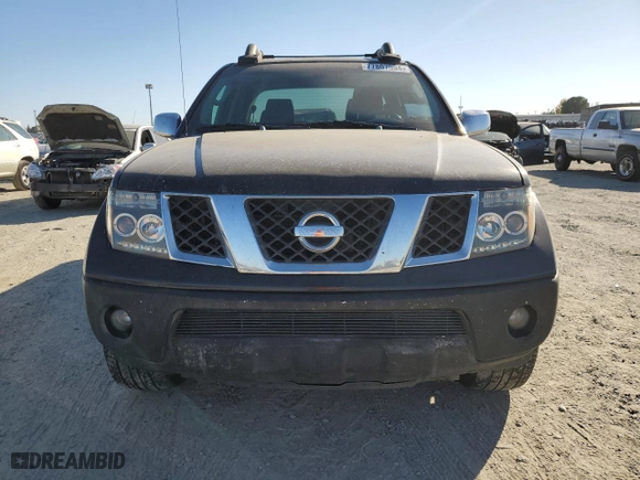2005 Nissan Frontier 4WD LE with VIN 1N6AD07W85C438898, listed as a Copart auction lot 77807994 with 203,619 mi miles and Salvage Title. Bid and sale history available at carsss.com. Image 5.