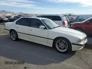 2000 BMW 7 Series 740iA with VIN WBAGG8341YDN78262, listed as a Copart auction lot 77690714 with 217,607 mi miles and Salvage Title. Bid and sale history available at carsss.com. Image 4.