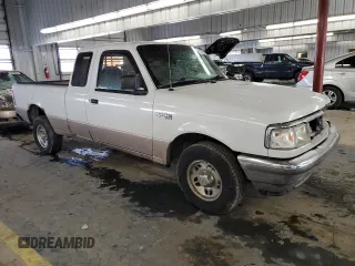 1997 Ford Ranger XLT with VIN 1FTCR14X0VPA56261, listed as a Copart auction lot 45174315 with 213,718 mi miles and Salvage Title. Bid and sale history available at DreamBid. Image 4.