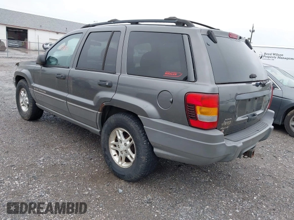 2002 Jeep Grand Cherokee with VIN 1J4GW38N62C190851, listed as a IAAI auction lot 42519384 with 142,066 mi miles and . Bid and sale history available at DreamBid. Image 3.