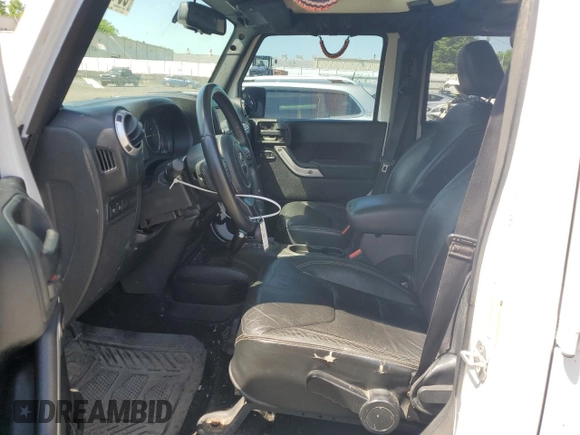 2013 Jeep Wrangler Unlimited Rubicon with VIN 1C4HJWFG2DL549064, listed as a Copart auction lot 56474055 with 148,217 mi miles and Salvage title. Bid and sale history available at DreamBid. Image 7.