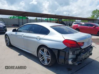 2015 BMW 6 Series 650i z VIN WBA6B2C55FGB99196, wystawiony jako IAAI lot #42107698 z przebiegiem 74 393 mil mil oraz . Historia ofert i sprzedaży dostępna na DreamBid. Obrazek 3.