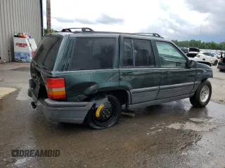 1995 Jeep Grand Cherokee Laredo with VIN 1J4FX58S8SC773884, listed as a Copart auction lot 56572555 with 424,126 mi miles and Salvage title. Bid and sale history available at DreamBid. Image 3.