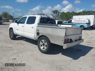 2014 Toyota Tacoma PreRunner with VIN 3TMJU4GN2EM169071, listed as a IAAI auction lot 41543601 with 304,594 mi miles. Bid and sale history available at carsss.com. Image 3.