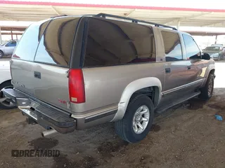 1999 GMC Suburban with VIN 3GKFK16R8XG501843, listed as a IAAI auction lot 42467263 with Not provided miles and . Bid and sale history available at DreamBid. Image 4.