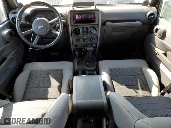 2008 Jeep Wrangler Unlimited X z VIN 1J4GA39128L518897, wystawiony jako Copart lot #52297525 z przebiegiem 163 676 mil mil oraz Nie do naprawy • Non repairable. Historia ofert i sprzedaży dostępna na DreamBid. Obrazek 8.