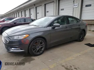 2018 Ford Fusion SE z VIN 3FA6P0HD8JR245391, wystawiony jako Copart lot #53571445 z przebiegiem 158 138 mil mil oraz Czysty tytuł • Clean title. Historia ofert i sprzedaży dostępna na DreamBid. Obrazek 1.