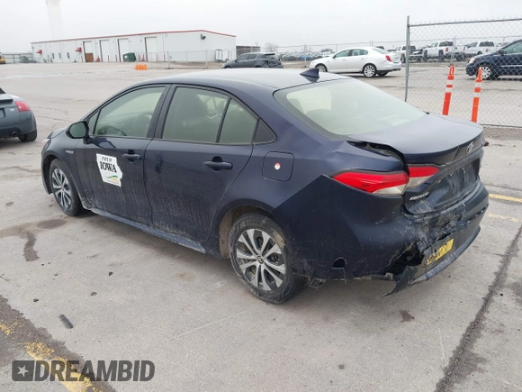 2021 Toyota Corolla Hybrid LE with VIN JTDEAMDE9MJ003172, listed as a IAAI auction lot 42062851 with 96,753 mi miles. Bid and sale history available at carsss.com. Image 3.