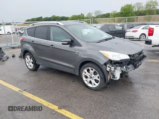 2016 Ford Escape Titanium with VIN 1FMCU9JX7GUA10640, listed as a IAAI auction lot 42578630 with 182,528 mi miles and . Bid and sale history available at DreamBid. Image 1.
