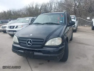 2001 Mercedes-Benz M-Class with VIN 4JGAB54E01A286893, listed as a IAAI auction lot 41799772 with 124,911 mi miles. Bid and sale history available at carsss.com. Image 6.