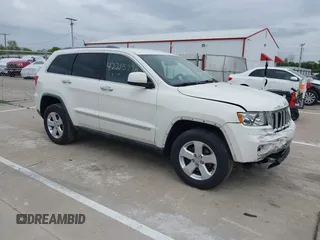 2011 Jeep Grand Cherokee Laredo with VIN 1J4RR4GG0BC736665, listed as a IAAI auction lot 42215770 with 184,135 mi miles and . Bid and sale history available at DreamBid. Image 1.
