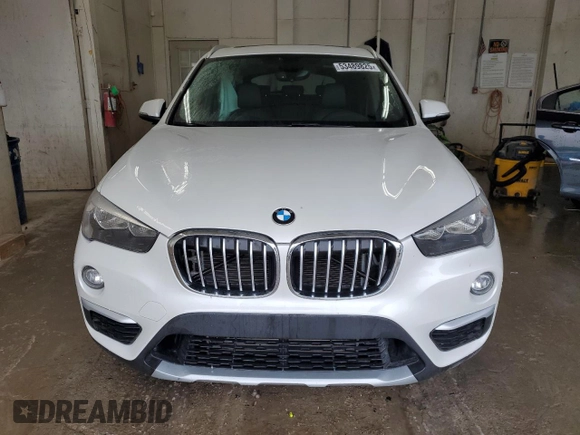 2018 BMW X1 xDrive28i с VIN WBXHT3C32J5K32348, выставлен на аукционе Copart как лот 53489825 с пробегом 61 972 миль миль и Списание • Salvage title. История ставок и продаж доступна на DreamBid. Изображение 5.