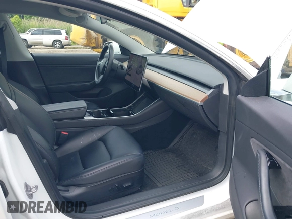2019 Tesla Model 3 Mid Range z VIN 5YJ3E1EA7KF299755, wystawiony jako IAAI lot #42354352 z przebiegiem Nie podano mil oraz . Historia ofert i sprzedaży dostępna na DreamBid. Obrazek 5.