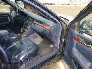 1999 Cadillac Seville Touring STS z VIN 1G6KY5493XU913994, wystawiony jako IAAI lot #41780695 z przebiegiem 60 375 mil mil oraz . Historia ofert i sprzedaży dostępna na DreamBid. Obrazek 5.