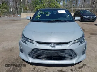 2014 Scion tC with VIN JTKJF5C70E3083839, listed as a IAAI auction lot 41886711 with 118,029 mi miles. Bid and sale history available at carsss.com. Image 12.