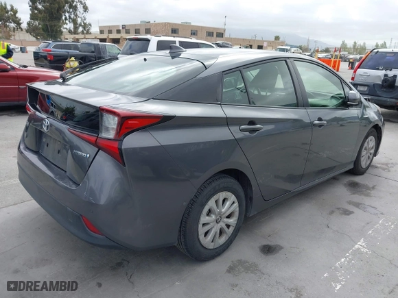 2019 Toyota Prius L Eco with VIN JTDKARFU9K3075219, listed as a IAAI auction lot 42113323 with 218,986 mi miles. Bid and sale history available at carsss.com. Image 4.