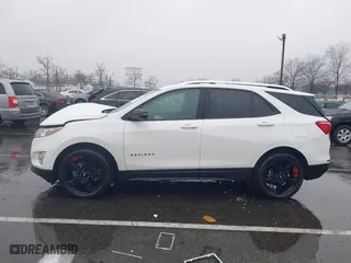 2021 Chevrolet Equinox Premier with VIN 2GNAXNEV7M6112087, listed as a IAAI auction lot 41102702 with 32,995 mi miles. Bid and sale history available at carsss.com. Image 14.