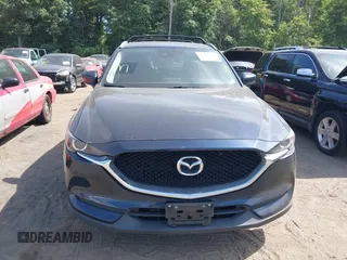 2017 Mazda CX-5 Touring z VIN JM3KFBCL5H0133493, wystawiony jako IAAI lot #39666644 z przebiegiem 125 048 mil mil oraz . Historia ofert i sprzedaży dostępna na DreamBid. Obrazek 13.