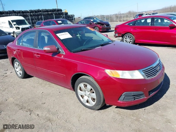 2009 Kia Optima LX with VIN KNAGE228X95314931, listed as a IAAI auction lot 41890304 with 217,901 mi miles. Bid and sale history available at carsss.com. Image 1.