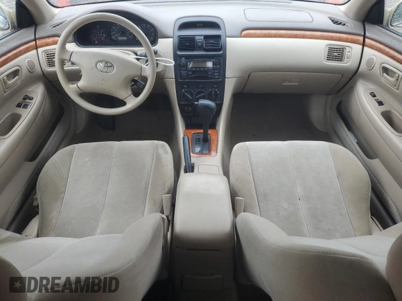 2002 Toyota Solara SE z VIN 2T1CE22P52C007118, wystawiony jako Copart lot #57048195 z przebiegiem 246 404 mil mil oraz Szkoda całkowita • Salvage title. Historia ofert i sprzedaży dostępna na DreamBid. Obrazek 8.