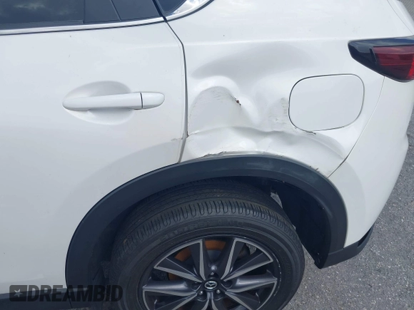 2018 Mazda CX-5 Touring z VIN JM3KFACM6J1419663, wystawiony jako IAAI lot #41879677 z przebiegiem 115 224 mil mil oraz . Historia ofert i sprzedaży dostępna na DreamBid. Obrazek 21.