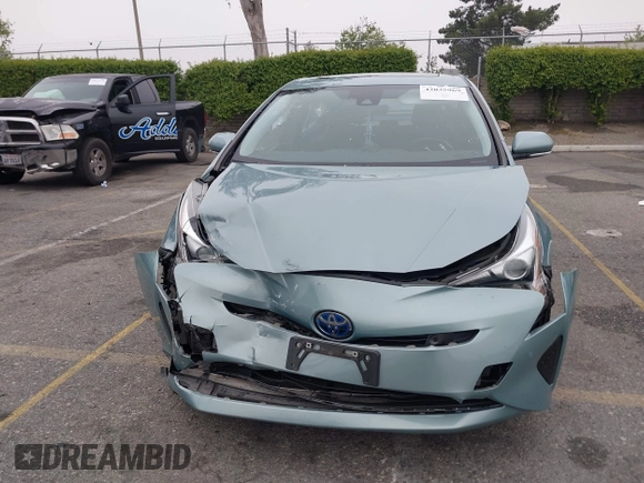 2017 Toyota Prius Two with VIN JTDKARFU7H3052594, listed as a IAAI auction lot 42035969 with 50,789 mi miles and . Bid and sale history available at DreamBid. Image 12.
