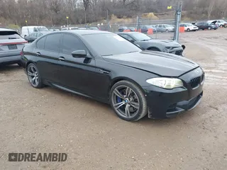 2013 BMW M5 with VIN WBSFV9C51DD095750, listed as a IAAI auction lot 40907304 with 93,014 mi miles. Bid and sale history available at carsss.com. Image 1.