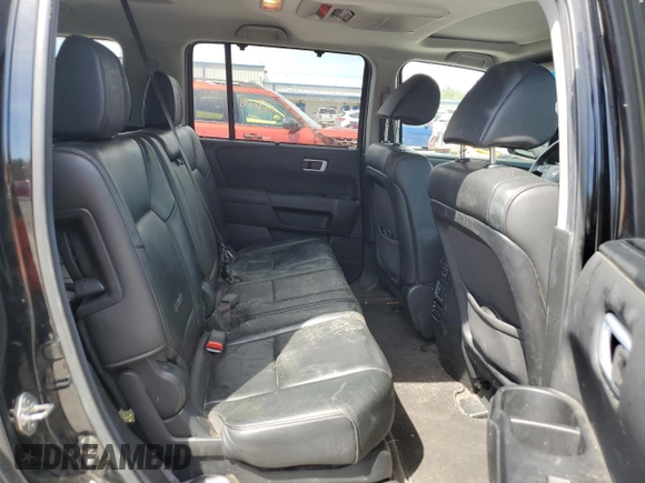 2013 Honda Pilot Touring z VIN 5FNYF4H97DB007336, wystawiony jako Copart lot #52785595 z przebiegiem 141 104 mil mil oraz Szkoda całkowita • Salvage title. Historia ofert i sprzedaży dostępna na DreamBid. Obrazek 11.