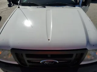 2011 Ford Ranger with VIN 1FTLR1EE0BPA14164, listed as a Copart auction lot 77312154 with 90,705 mi miles and Salvage Title. Bid and sale history available at DreamBid. Image 11.