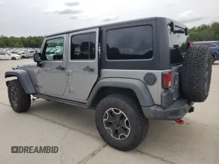 2013 Jeep Wrangler Unlimited Rubicon 10th Anniversary z VIN 1C4HJWFG3DL703331, wystawiony jako Copart lot #70823154 z przebiegiem 148 860 mil mil oraz Szkoda całkowita • Salvage title. Historia ofert i sprzedaży dostępna na DreamBid. Obrazek 2.