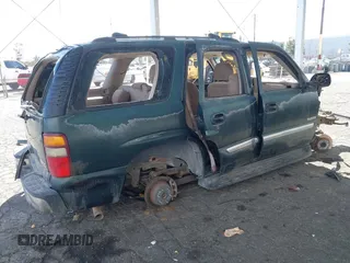 2003 GMC Yukon SLT z VIN 1GKEC13V43J304588, wystawiony jako IAAI lot #41525446 z przebiegiem Nie podano mil oraz . Historia ofert i sprzedaży dostępna na DreamBid. Obrazek 4.