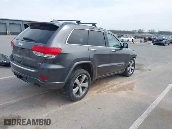2014 Jeep Grand Cherokee Overland with VIN 1C4RJFCT6EC187098, listed as a IAAI auction lot 42077453 with 172,220 mi miles and . Bid and sale history available at DreamBid. Image 4.
