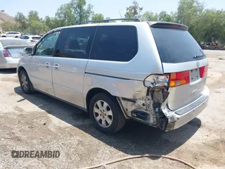2004 Honda Odyssey EX-L with VIN 5FNRL18774B028164, listed as a IAAI auction lot 42454877 with 135,720 mi miles and . Bid and sale history available at DreamBid. Image 3.