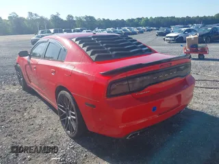 2013 Dodge Charger SXT with VIN 2C3CDXHGXDH742942, listed as a IAAI auction lot 42025564 with 292,681 mi miles. Bid and sale history available at carsss.com. Image 3.